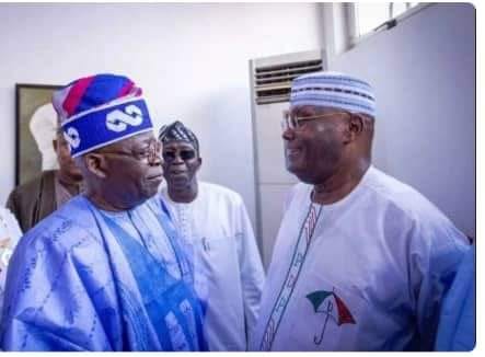 Two political foes, Bola Ahmed Tinubu (L) of the All Progressives Congress (APC) and Atiku Abubakar (R) of the People's Democratic Party (PDP) exchanging pleasantries while national chairman of the PDP, Senator Iyorchia Ayu (M), looks on.