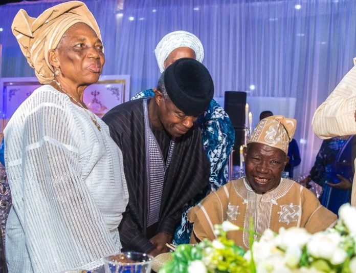 THE FIRST CIVILIAN GOVERNOR OF LAGOS STATE, LATE ALHAJI LATEEF KAYODE JAKANDE FLANKED BY HIS WIFE AND THE VICE PRESIDENT, PROF. YEMI OSIBANJO ON HIS 90TH. BIRTHDAY