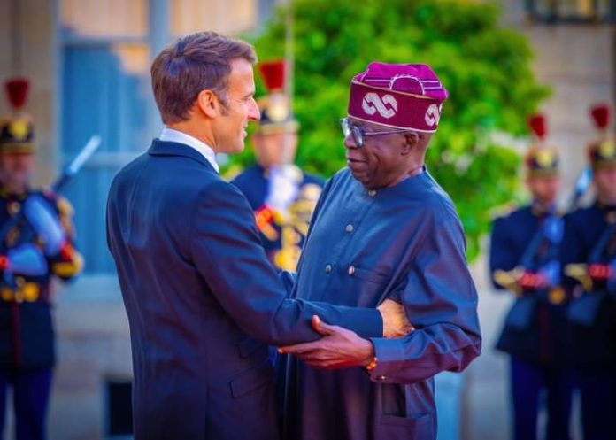 President Bola Ahmed Tinubu of Nigerian in a warm embress with President Macron of France during the Former's visit to Paris for France - Africa Summit 2023