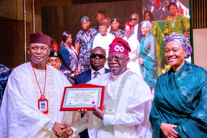 INEC Chairman Prof. Mamood Abubakar present the Certificate of Returns to President-Elect of Nigeria, Bola Ahmed Tinubu