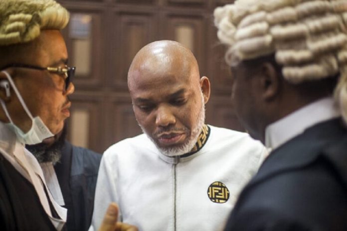 IPOB Leader, Mazi Nnamdi Kanu flanked by his lawyers in Court.